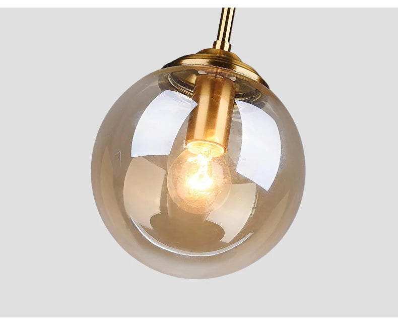 Close-up of frosted glass shade on modern nordic metal pendant lamp showing even light diffusion and smooth sculptural glass profile