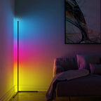 Minimalist LED corner floor lamp casting warm 2700K ambient light in a dimly lit bedroom at night
