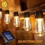 Solar bulb string lights outdoor hanging across garden fence with warm retro amber glow at dusk