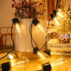 Waterproof solar string lights with vintage globe bulbs strung along balcony railing at night warm white light