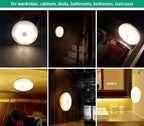 motion sensor night light glowing softly in dark room
